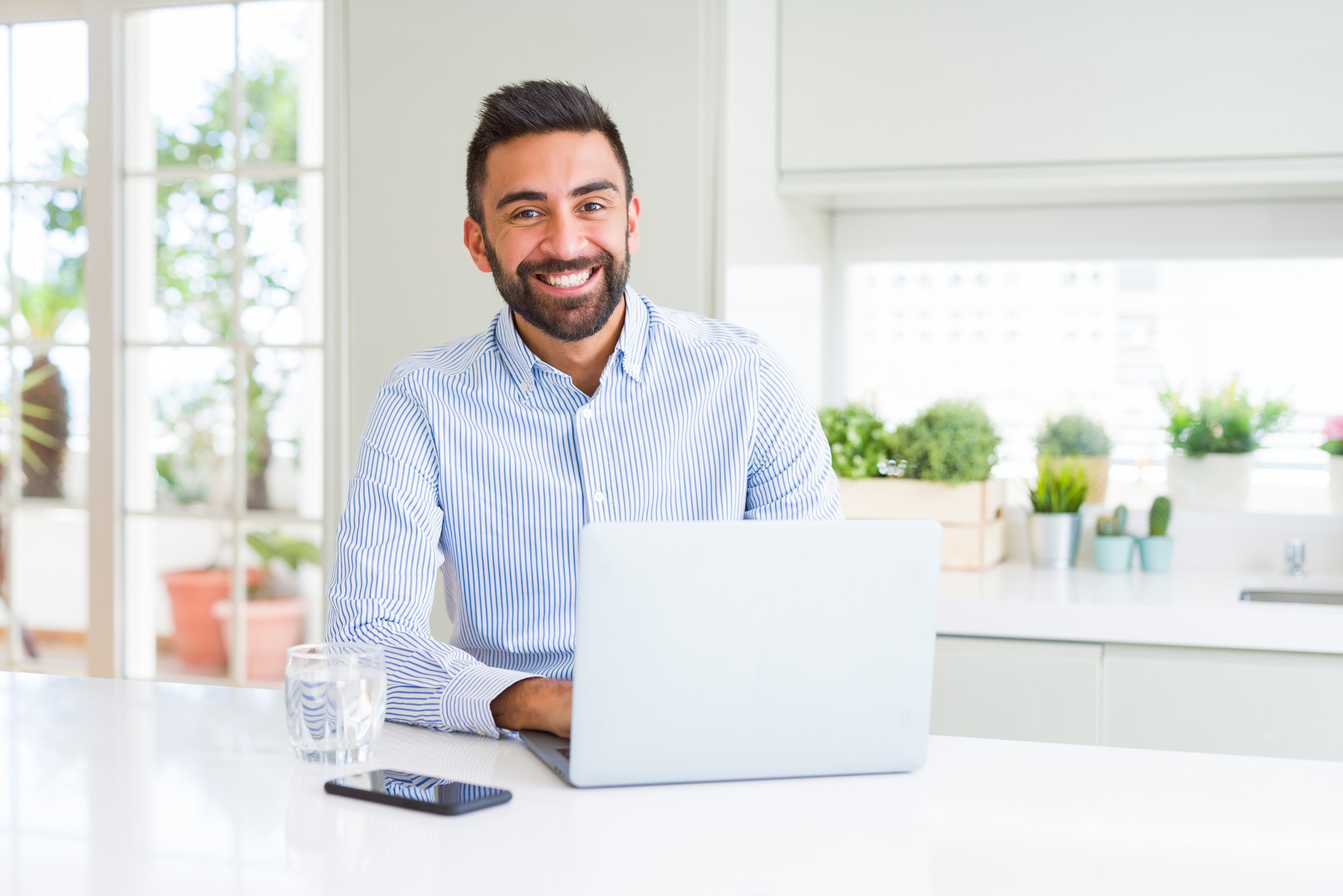 Business man smiling working using computer laptop